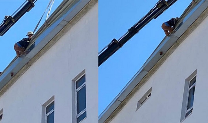 İnşaat işçisi çatıda asılı kaldı