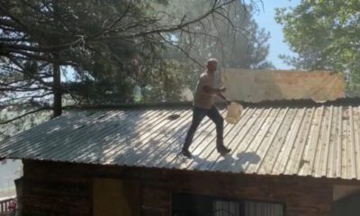 Benzin bidonuyla çatıya çıktı
